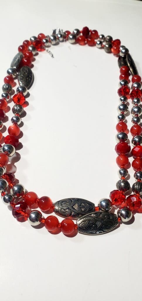 Long red beaded necklace